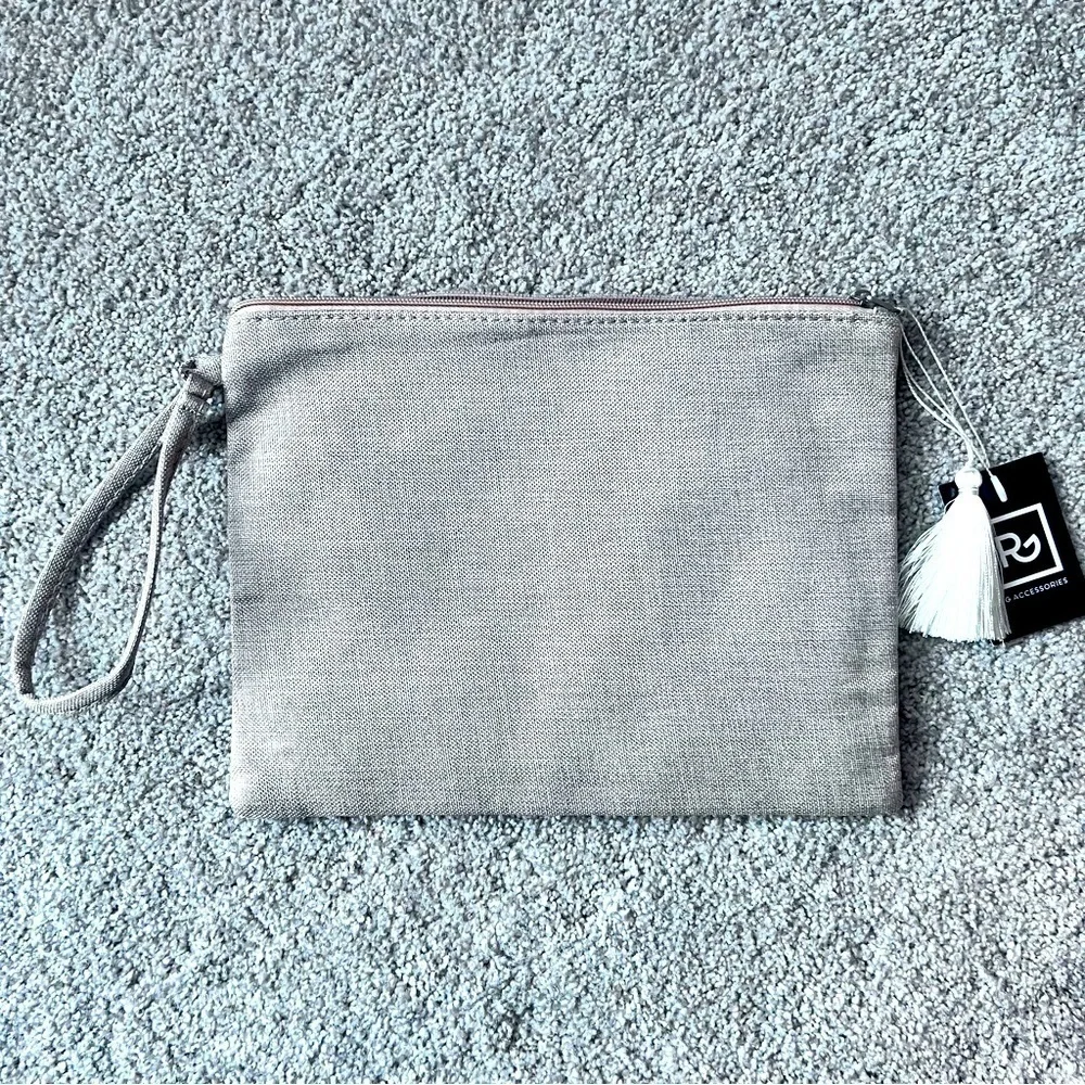 NWT sequin eye zippered pouch with wristlet strap